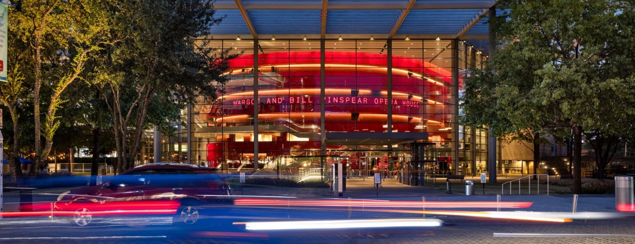 Directions & Parking at the WInspear Opera House - The Dallas Opera House with cars driving by at night