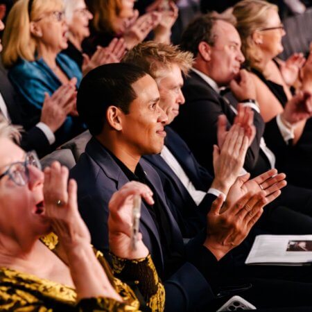 Gold - Patrons applauding a performance at The Dallas Opera